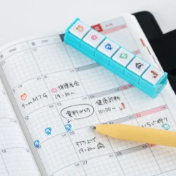 Hobonichi 2026 Accessories: Tamagotchi - Pochitto6 Push-Button Stamp